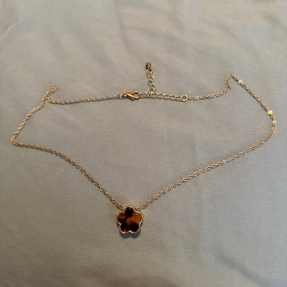 Tort shell necklace on gold toned chain